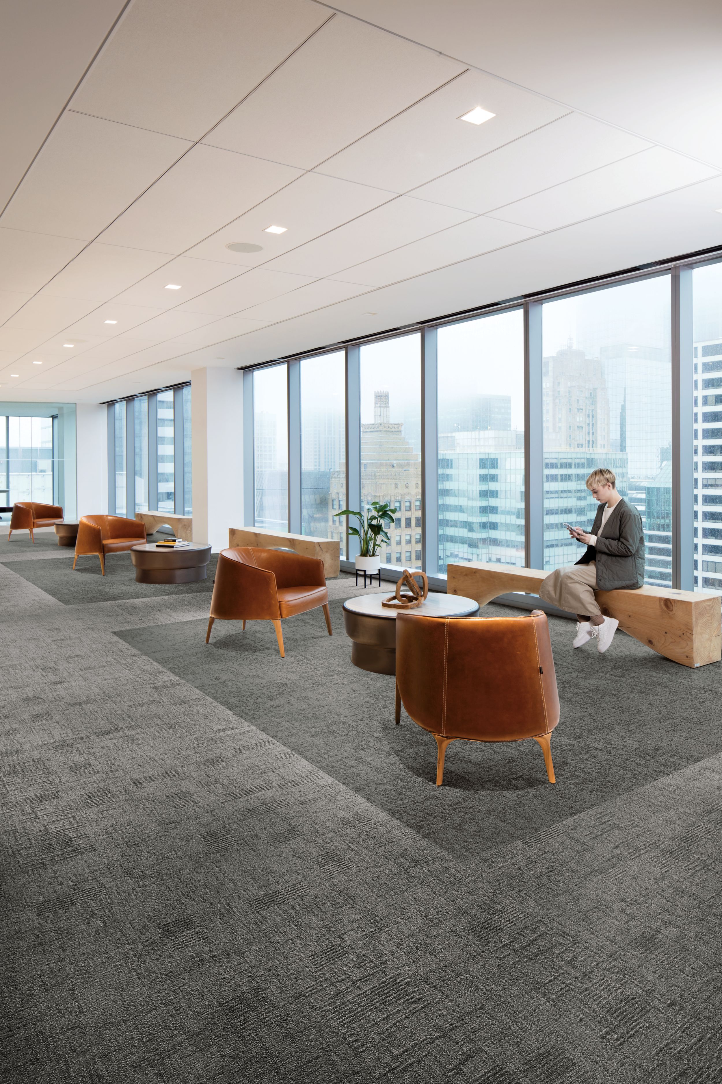 Interface Tokyo Texture and Vintage Kimono carpet tile in seating area with leather chairs and window bench  image number 3